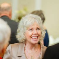 Marcia Haas talking with guests at the Foundation Holiday Reception